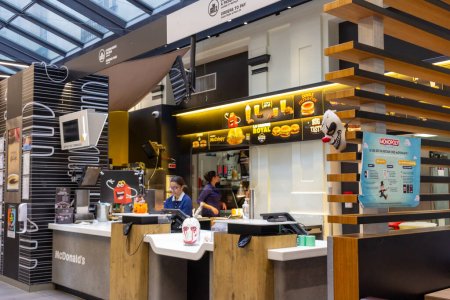 Photo for Bordeaux, France October 23, 2023: Counter and Kitchen Area of McDonald's at the Train Station - Royalty Free Image