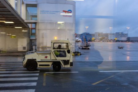 Photo for Ile de France, France October 24, 2023: Ground Support in Action - Pushback Truck at Charles de Gaulle Airport - Royalty Free Image