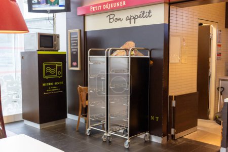 Photo for Ile de France, France October 24, 2023: Convenience on the Go - Microwave in Charles de Gaulle Airport Dining Area - Royalty Free Image