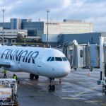 Aeroport Charles de Gaulle, France October 24, 2023: Docking of Boarding Bridge to Finnair Aircraft