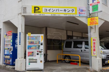 Photo for Tokyo, Japan, October 25, 2023: Covered Parking Entrance with Vending Machines and Pricing Sign - Royalty Free Image