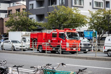 Photo for Tokyo, Japan, 28 October 2023: Fire department vehicles parked on a Tokyo street - Royalty Free Image