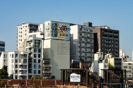 Photo for Tokyo, Japan, 28 October 2023 : Asahi Super Dry advertisement on apartment building - Royalty Free Image