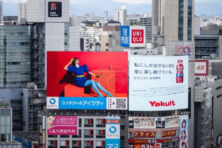 Photo for Tokyo, Japan, 29 October 2023: Collage of colorful billboards on a city building - Royalty Free Image