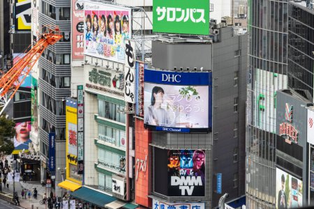 Photo for Tokyo, Japan, 29 October 2023: Collage of various billboards on buildings in a bustling city area - Royalty Free Image