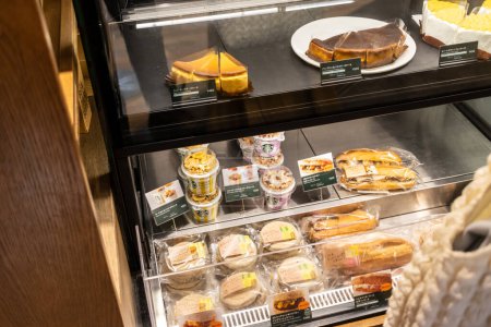 Photo for Tokyo, Japan, 29 October 2023: Variety of food items in Starbucks store display - Royalty Free Image