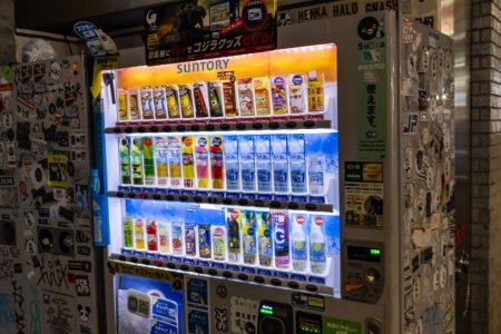 Photo for Tokyo, Japan, 29 October 2023: Colorful vending machines with beverages by Suntory in Tokyo - Royalty Free Image