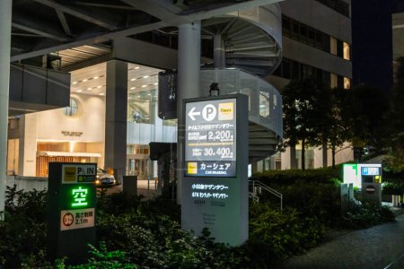 Photo for Tokyo, Japan, 29 October 2023: Night View of Parking Signage at a Tokyo Building Complex - Royalty Free Image