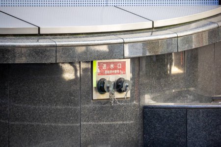 Photo for Tokyo, Japan, 30 October 2023 : Fire department connection on building exterior - Royalty Free Image