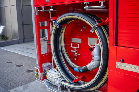 Photo for Tokyo, Japan, 30 October 2023: Close-up of hose and equipment on a fire truck - Royalty Free Image