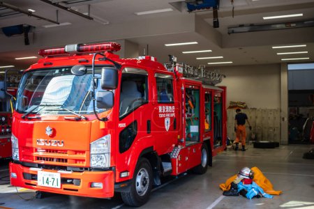 Photo for Tokyo, Japan, 30 October 2023: Firefighter equipment and trucks inside a fire station garage - Royalty Free Image