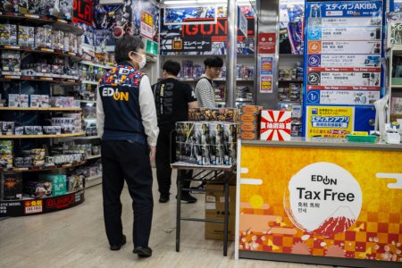 Photo for Tokyo, Japan, 30 October 2023 : Customers browsing in a hobby shop with model kits and action figures in Akihabara - Royalty Free Image