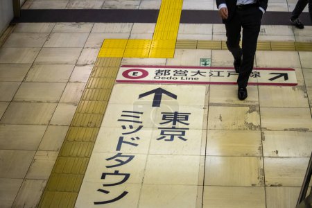 Photo for Tokyo, Japan, 31 October 2023: Commuter on the Oedo Subway Line Platform - Royalty Free Image
