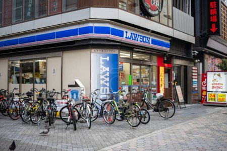 Photo for Tokyo, Japan, 31 October 2023: Lawson Convenience Store Front with Bicycle Parking - Royalty Free Image