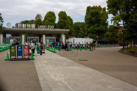 Photo for Tokyo, Japan, 31 October 2023: Entrance of Ueno Zoo with visitors and stroller parking - Royalty Free Image