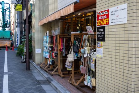 Photo for Tokyo, Japan, 1 November 2023: Sidewalk sale outside a local fashion boutique in Tokyo - Royalty Free Image