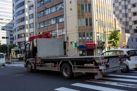Photo for Tokyo, Japan, 1 November 2023: Fire Truck on Urban Street in Tokyo - Royalty Free Image