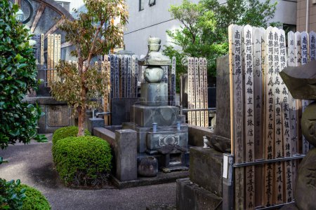 Photo for Tokyo, Japan, 1 November 2023: Traditional Japanese Cemetery with Stone Monuments and Lanterns - Royalty Free Image
