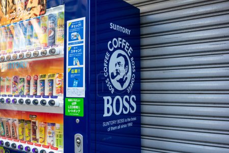 Photo for Tokyo, Japan, 1 November 2023: Suntory Boss Coffee Vending Machine on Sidewalk - Royalty Free Image