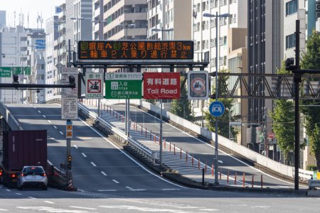 Photo for Tokyo, Japan, 1 November 2023: Digital traffic sign over toll road entrance in Tokyo - Royalty Free Image