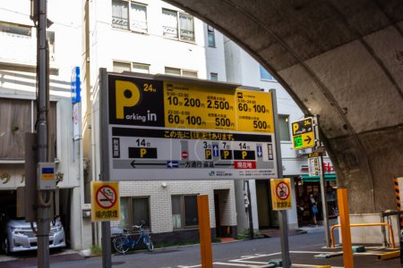 Photo for Tokyo, Japan, 1 November 2023: Signage for 24-hour public parking with pricing information - Royalty Free Image