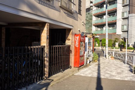 Photo for Tokyo, Japan, 1 November 2023: Sidewalk with bicycle parking and a vending machine - Royalty Free Image