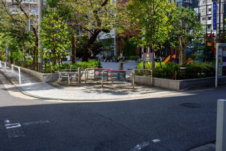 Photo for Tokyo, Japan, 1 November 2023: Outdoor Seating Area in a Japanese City Park - Royalty Free Image