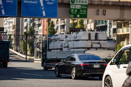 Photo for Tokyo, Japan, 1 November 2023: Traffic under directional signs toward Ueno and Nihonbashi - Royalty Free Image