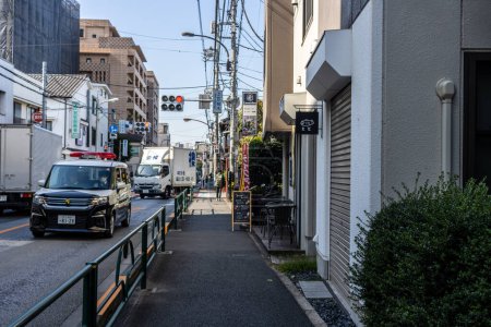 Photo for Tokyo, Japan, 2 November 2023: Ambulance responding to an emergency in Minato District - Royalty Free Image