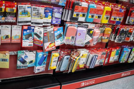 Photo for Tokyo, Japan, 2 November 2023: Assortment of Mobile Accessories on Display in Electronics Store - Royalty Free Image