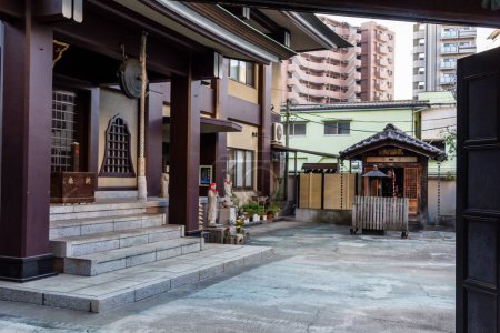 Photo for Tokyo, Japan, 2 November 2023: Traditional shrine with modern buildings in the background - Royalty Free Image