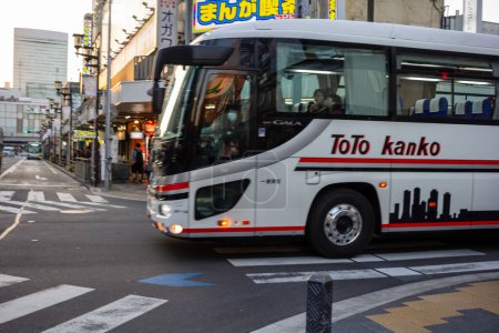 Photo for Tokyo, Japan, 3 November 2023: ToTo Kanko Bus in Urban Street Setting - Royalty Free Image