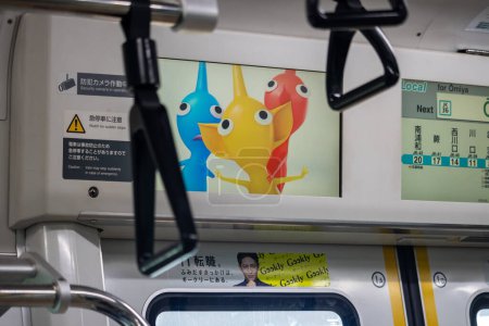 Photo for Tokyo, Japan, 3 November 2023: Advertisement inside a Japanese train - Royalty Free Image
