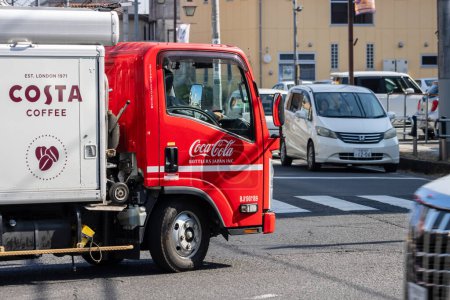 Photo for Tokyo, Japan, 3 November 2023: Costa Coffee Delivery Truck in Urban Traffic - Royalty Free Image
