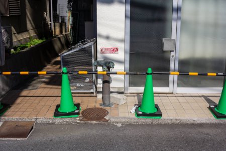 Photo for Tokyo, Japan, 3 November 2023: City street with safety traffic cones and barriers - Royalty Free Image