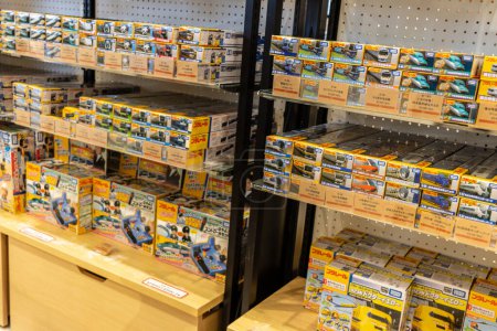 Photo for Tokyo, Japan, 3 November 2023: Shelves stocked with Tamiya model kits in a hobby store - Royalty Free Image