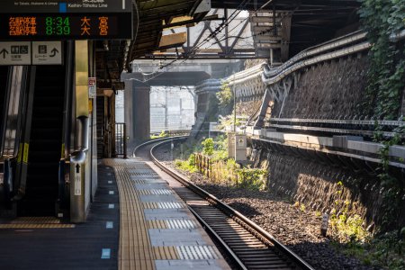 Photo for Tokyo, Japan, 3 November 2023: Morning sunlight at a local train station - Royalty Free Image