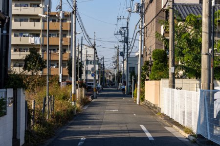 Photo for Tokyo, Japan, 3 November 2023: Quiet residential street in Tokyo with power lines - Royalty Free Image