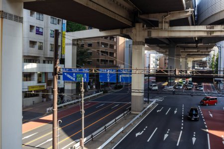 Photo for Tokyo, Japan, 4 November 2023: Urban Traffic Under Elevated Highways in Tokyo - Royalty Free Image