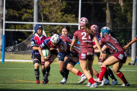 Photo for Tokyo, Japan, 4 November 2023: Intense Women's Rugby Match with Players Engaged in a Scrum - Royalty Free Image