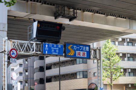 Photo for Tokyo, Japan, 4 November 2023: Directional Road Signs under Expressway in Nihonbashi and Shibuya Districts - Royalty Free Image