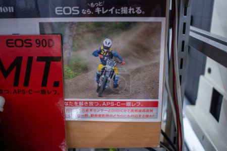 Photo for Tokyo, Japan, November 5 2023 : Canon advertisement in a Japanese store displaying a motocross scene - Royalty Free Image