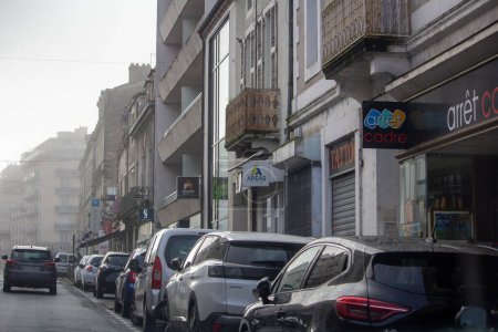 Photo for France, 30 March 2024: Urban Street View with Local Shops - Royalty Free Image