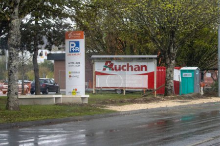 Photo for France, 01 April 2024: Auchan Signage on a Wet Day - Royalty Free Image