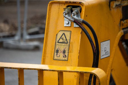 Photo for France, 10 March 2024: Close-up of High-Voltage Warning on Yellow Construction Machinery - Royalty Free Image