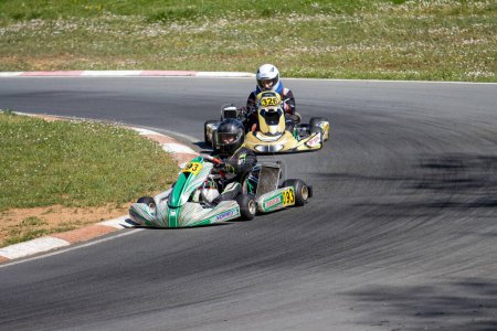 Photo for France, 14 April, 2024: Intense kart racing competition at a sunlit track - Royalty Free Image