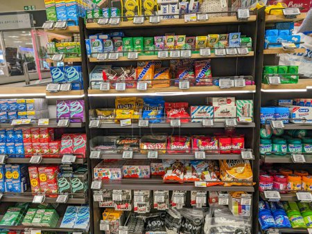 Photo for France, 23 March 2024: Retail shelf stocked with a variety of confectionery and hygiene products. - Royalty Free Image