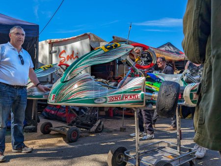 Photo for France, April 14, 2024: Go-kart racers prepare their vehicles at an outdoor karting event. - Royalty Free Image