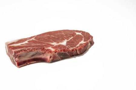 A raw beef steak, isolated on a white background.