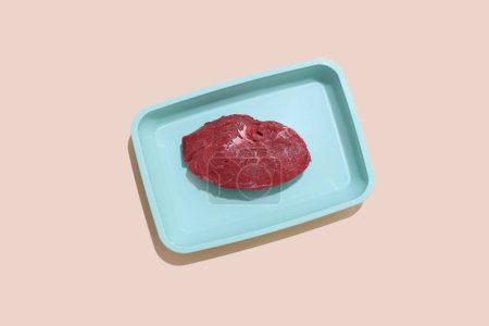 Foto de Raw meat on color background ready for cooking. Food concept. - Imagen libre de derechos